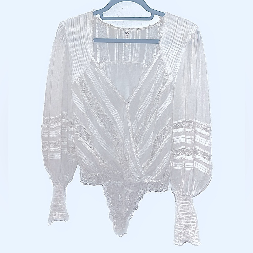 White Free People medium body suit.